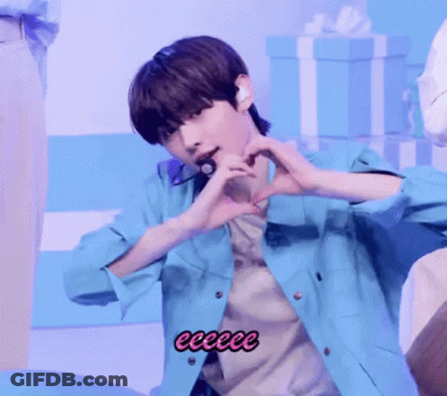Young Man Making Heart With Hands In Blue Jacket GIF