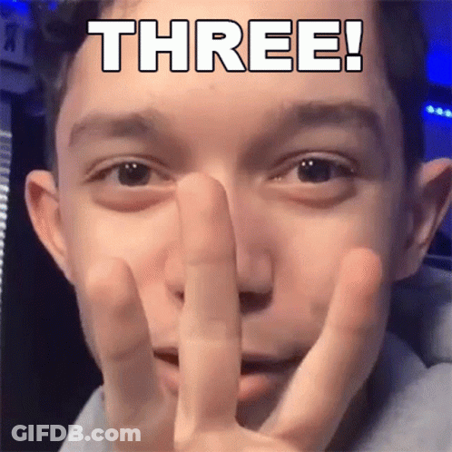 Young Man Making Peace Sign With Three GIF