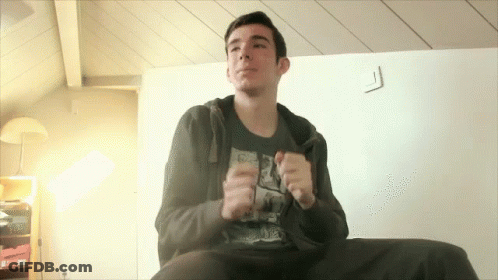 Young Man On Couch In Black Shirt With Drawing GIF