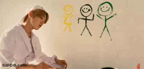 Young Man Painting Stick Figures On Wall GIF