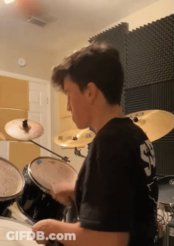 Young Man Playing Drums In SD Shirt GIF