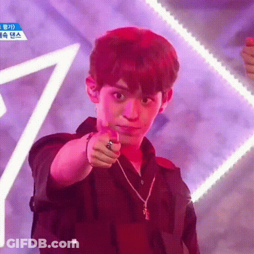 Young Man Pointing At Camera In Black Shirt And Necklace GIF