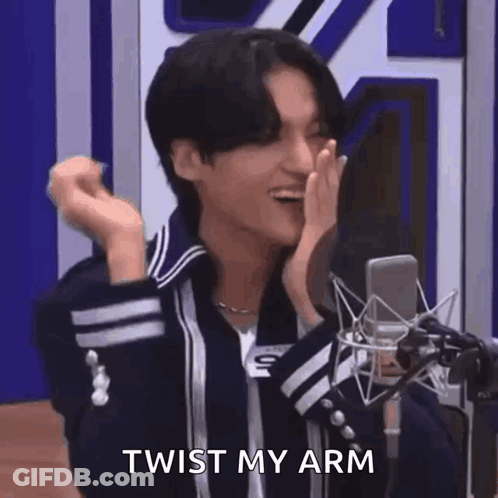 Young Man Pointing At Camera In Front Of Microphone GIF