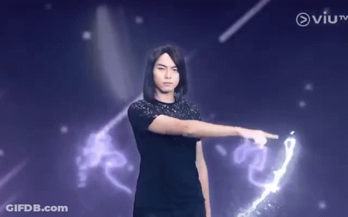 Young Man Pointing At Purple Background GIF