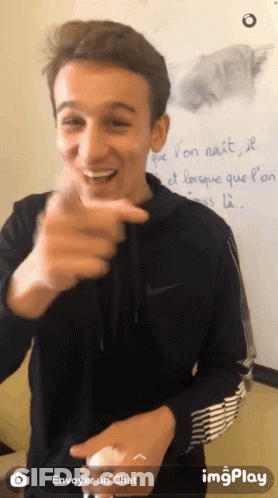 Young Man Pointing At Whiteboard Saying Envoyer Un Chat GIF