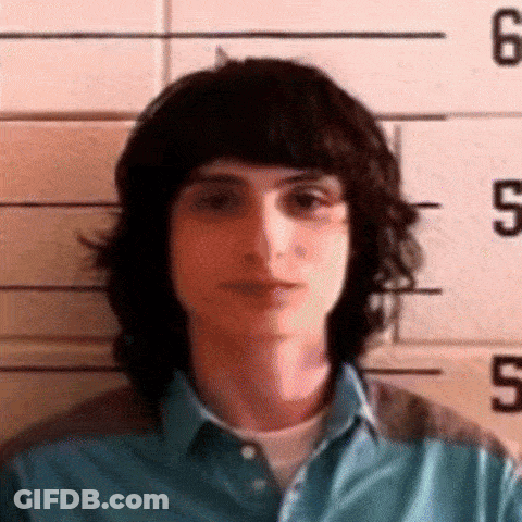 Young Man Posing In Front Of Police Line GIF