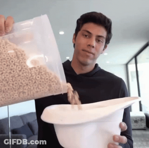 Young Man Pouring Cereal GIF