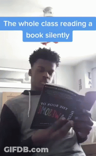 Young Man Reading Whole Class Book Silently GIF