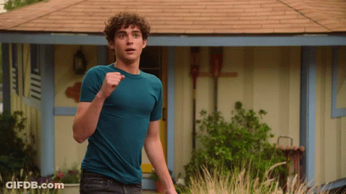 Young Man Running In Blue Shirt GIF