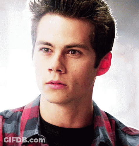 Young Man's Face In Front Of Window With Blinds GIF