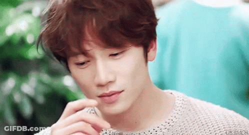 Young Man's Face With Hand GIF