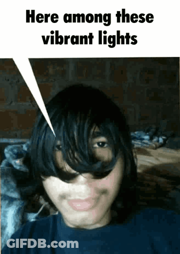 Young Man Saying Here Among Vibrant Lights GIF