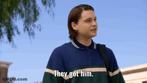 Young Man Saying They Got Him Holding Backpack GIF