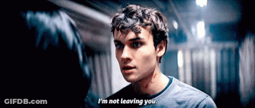 Young Man Says I'm Not Leaving You To Woman In Dark Hallway GIF