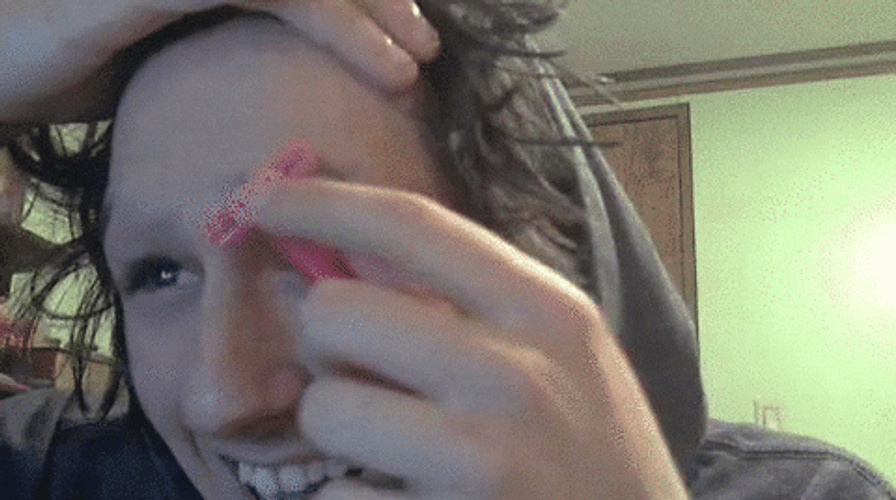 Young Man Shaving His Eyebrows GIF