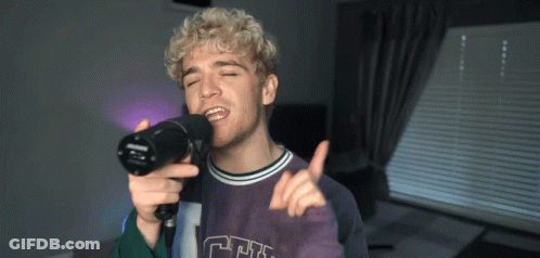 Young Man Singing Into Microphone CF Shirt GIF