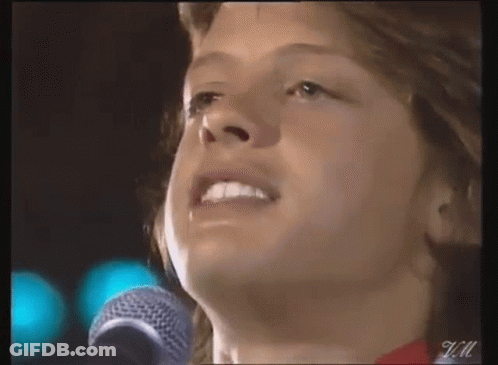 Young Man Singing Into Microphone GIF