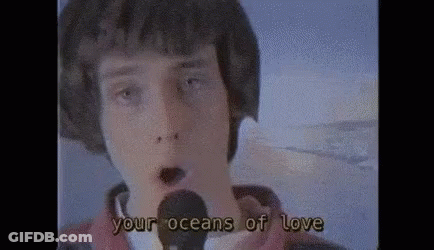 Young Man Singing Into Microphone Your Oceans Of Love GIF