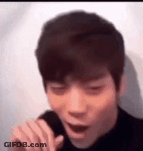 Young Man Singing With Funny Face GIF