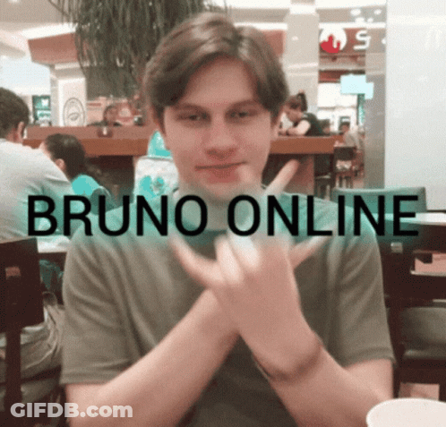 Young Man Sitting At Bruno Online Table GIF