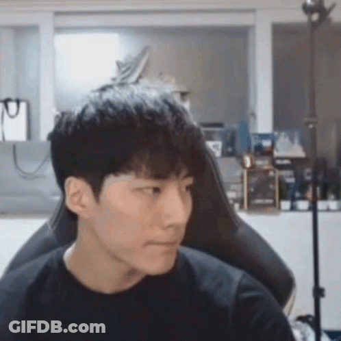 Young Man Sitting At Computer GIF