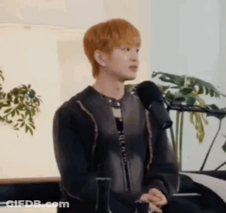 Young Man Sitting At Microphone GIF