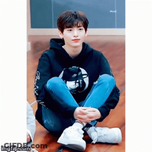 Young Man Sitting Cross-Legged GIF