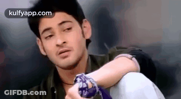 Young Man Sitting Hands On Knees Looking GIF