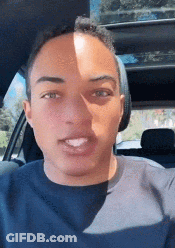 Young Man Sitting In Back Seat Of Car Mouth Open GIF