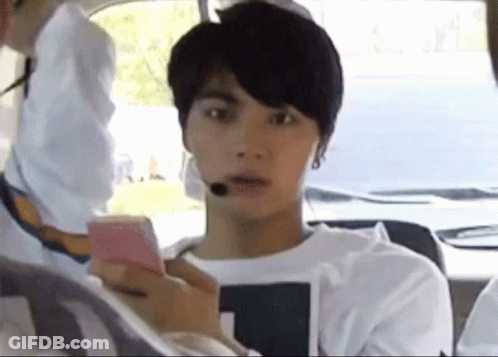 Young Man Sitting In Car Using Cell Phone GIF