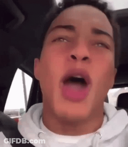 Young Man Sitting In Car With Tongue Hanging Out GIF