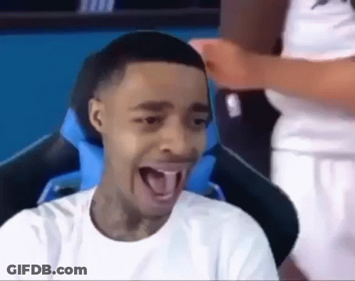 Young Man Sitting In Chair With Tongue Out GIF