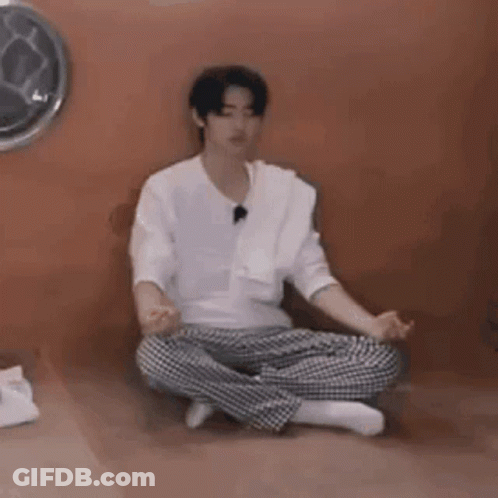 Young Man Sitting In Lotus Position GIF