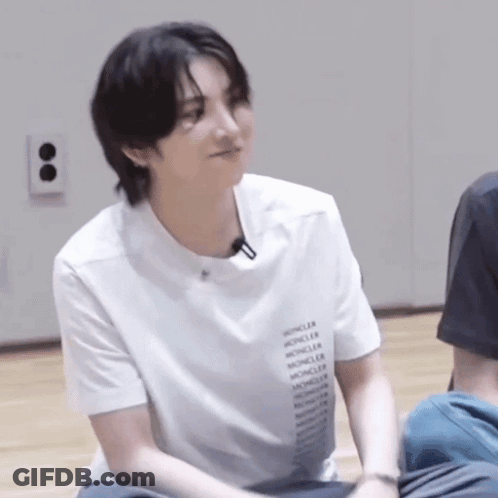 Young Man Sitting On Floor Smiling GIF