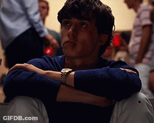 Young Man Sitting With Arms Crossed GIF