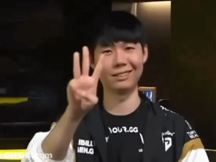Young Man Smiling And Giving Peace Sign GIF