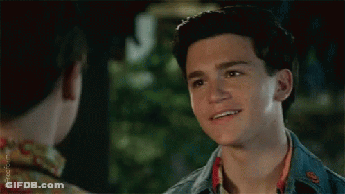 Young Man Smiling At Friend In Floral Shirt GIF