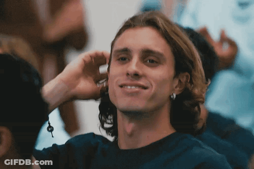 Young Man Smiling Covering Ear GIF