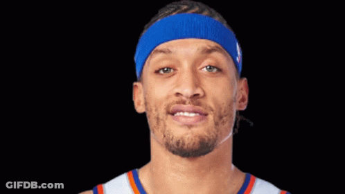 Young Man Smiling In Basketball Jersey GIF