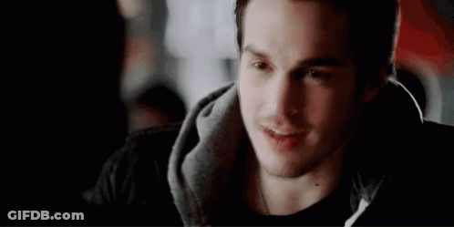 Young Man Smiling In Black Hoodie GIF