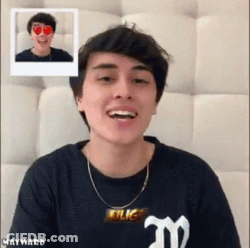 Young Man Smiling In Black Shirt With M GIF