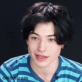Young Man Smiling In Blue And White Striped Shirt GIF