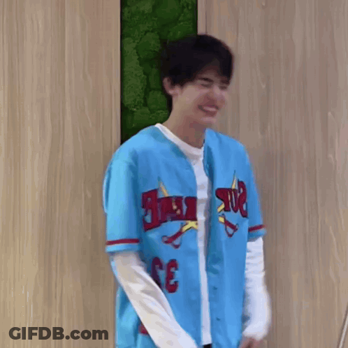 Young Man Smiling In Blue Baseball Jersey GIF
