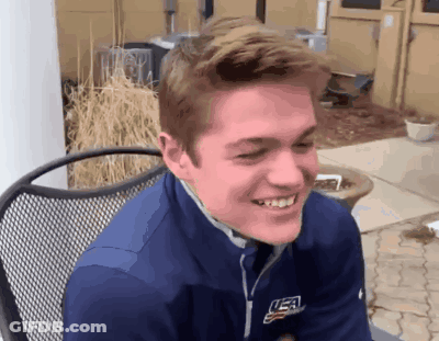 Young Man Smiling In Blue USA Jacket GIF