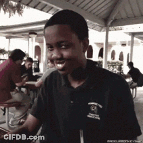 Young Man Smiling In Brooklyn Shirt GIF