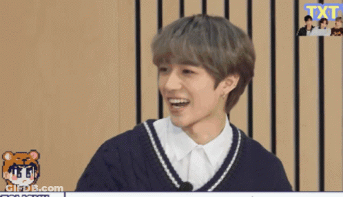 Young Man Smiling In Front Of Screen Saying Txt GIF