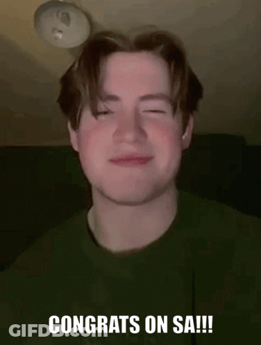 Young Man Smiling In Green Shirt GIF