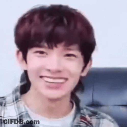 Young Man Smiling In Plaid And White Shirt GIF
