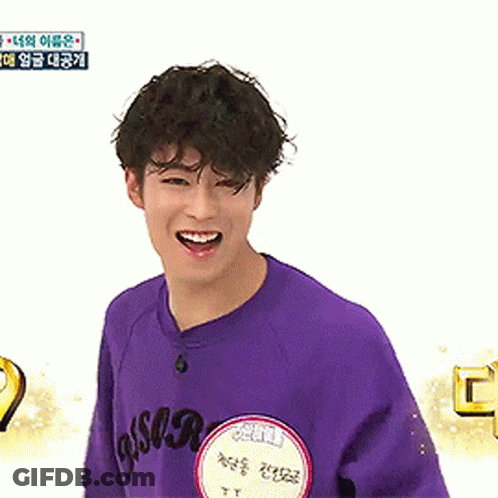 Young Man Smiling In Purple Shirt GIF