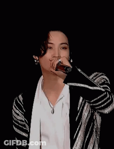 Young Man Smiling In White Shirt And Black-And-White Jacket GIF